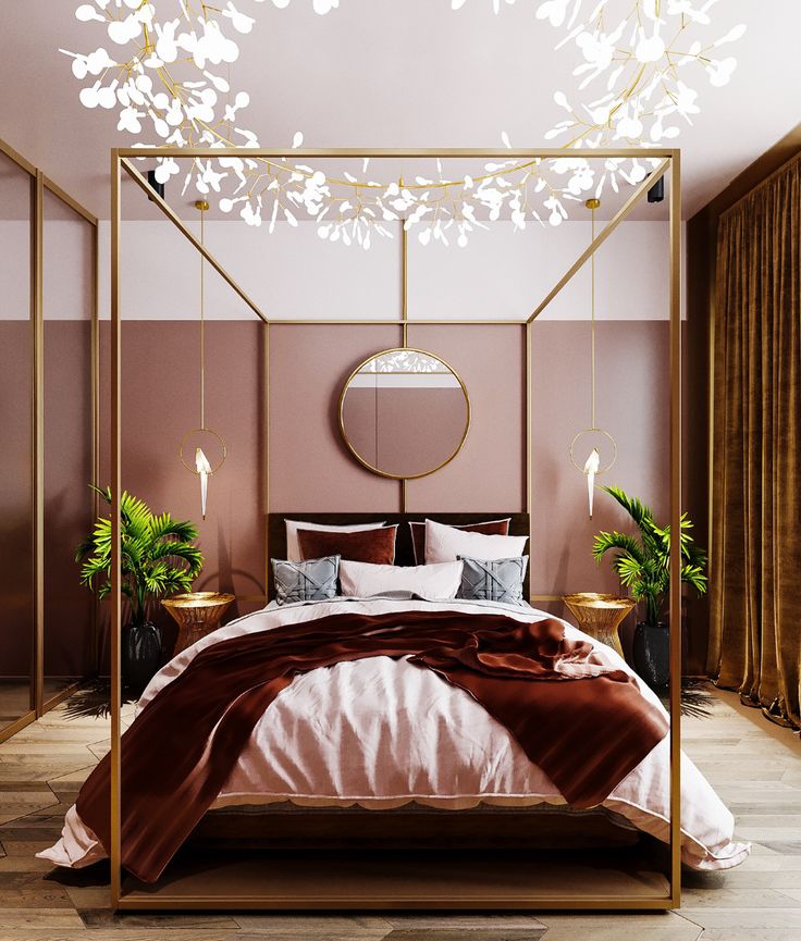 a bedroom with a canopy bed and hanging lights above the bed, along with potted plants