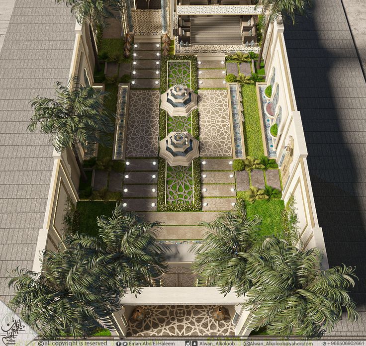 an aerial view of a courtyard with palm trees and potted plants in the center