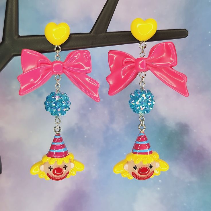 Bright and colorful party hat clown earrings - Halloween earrings - Circus jewelry - carnival - Lolitafashion earrings - post dangle earrings The perfect earrings for clowning around! Makes a great gift idea as well. Both wide plastic and silicone rubber backings included for comfort (pictured with plastic backings) **Stainless steel earring posts are hypoallergenic and nickel free Made of resin / plastic Charms are one sided and flat on the back Earring length is: 3 1/4" (in) Earring width is: Yellow Novelty Jewelry For Party, Pink Novelty Earrings For Party, Adjustable Fun Party Earrings, Novelty Multicolor Earrings For Birthday, Cute Halloween Party Jewelry, Fun Dangle Earrings For Party, Fun Adjustable Earrings For Birthday, Quirky Dangle Earrings For Party, Pink Halloween Party Earrings