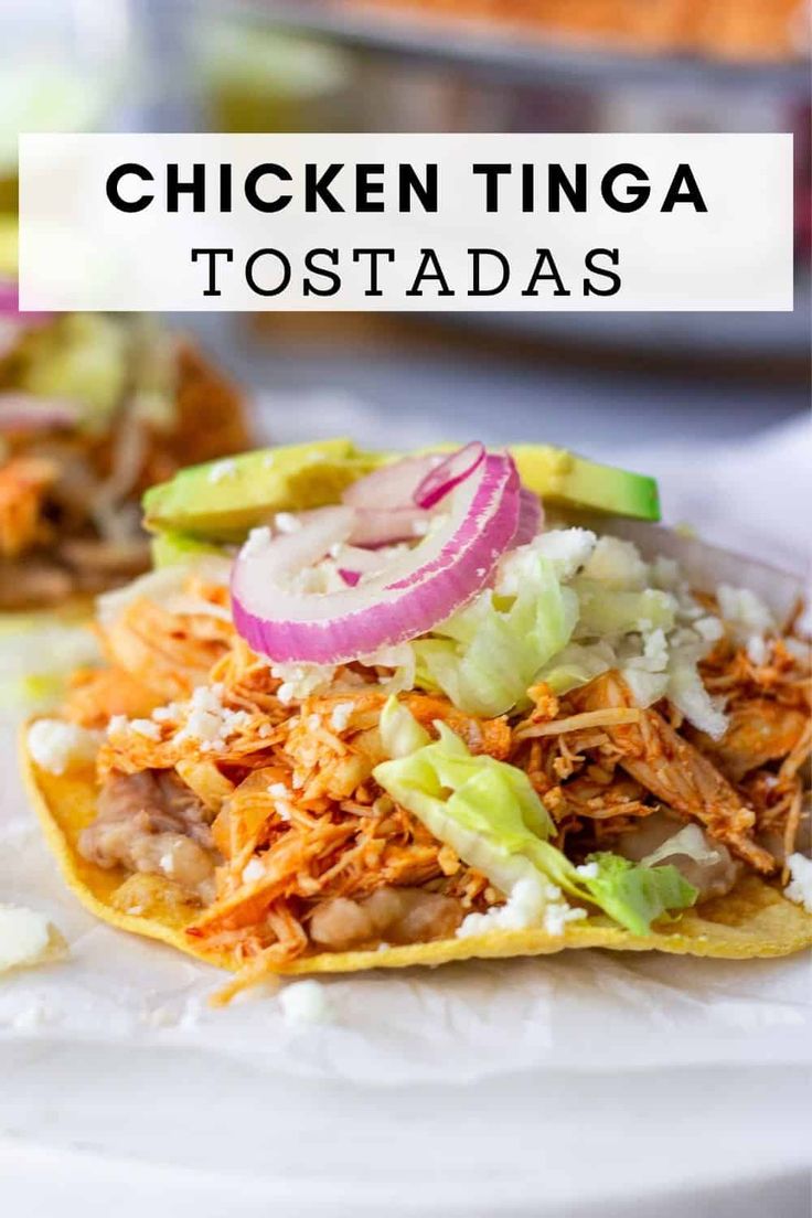 chicken tinga tostadas on a white plate with text overlay that reads, chicken tinga tostadas