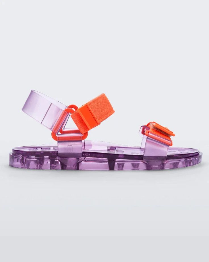 Trendy Plastic Sandals For Summer, Summer Synthetic Jelly Sandals With Adjustable Strap, Summer Jelly Sandals With Adjustable Strap, Trendy Jelly Sandals For Summer, Trendy Sandals With Translucent Outsole, Trendy Plastic Jelly Sandals For Vacation, Spring Vacation Plastic Jelly Sandals, Casual Clear Sandals For Summer, Trendy Sandals With Transparent Straps For Beach