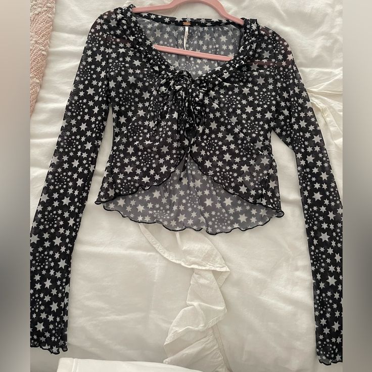 Free People Blouse, Perfect Condition Never Worn Black With Stars Star Print Tops For Night Out In Spring, Spring Party Tops With Star Print, Casual Star Print Tops For Party, Casual Party Top With Star Print, Black Star Print Top For Spring, Black Tops With Star Print For Spring, Black Star Print Tops For Spring, Fitted Long Sleeve Tops With Star Print, Free People Blouse