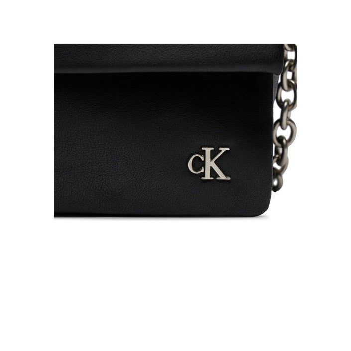 Brand: Calvin Klein Gender: Women Type: Bags Season: Spring/Summer PRODUCT DETAIL • Color: black • Pattern: plain • Fastening: with clip • Size (cm): 15x25x9 • Details: -shoulder bags COMPOSITION AND MATERIAL • Composition: -51% polyester -49% polyurethane • Washing: machine wash at 30° Modern Shoulder Bags With Branded Hardware, Modern Black Shoulder Bag With Branded Hardware, Classic Everyday Shoulder Bag With Logo Hardware, Everyday Satchel Shoulder Bag With Logo Hardware, Black Satchel Bag With Logo Hardware, Modern Bags With Logo Hardware For Daily Use, Modern Bags With Logo Hardware, Classic Calvin Klein Shoulder Bag For Daily Use, Trendy Bags With Logo Hardware For Daily Use