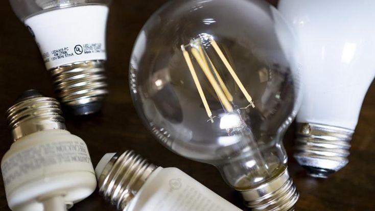 several different types of light bulbs on a table