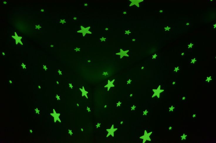 green stars glow against a black background