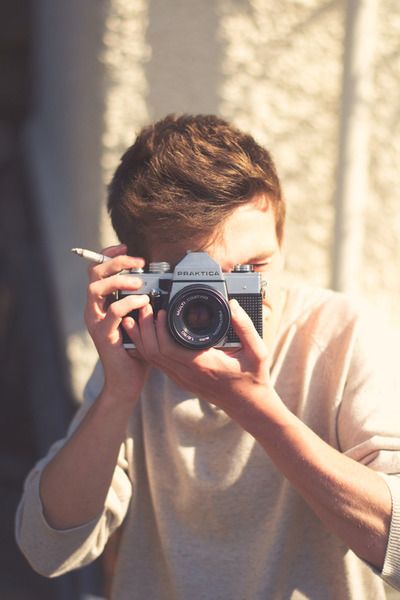 a man taking a photo with his camera