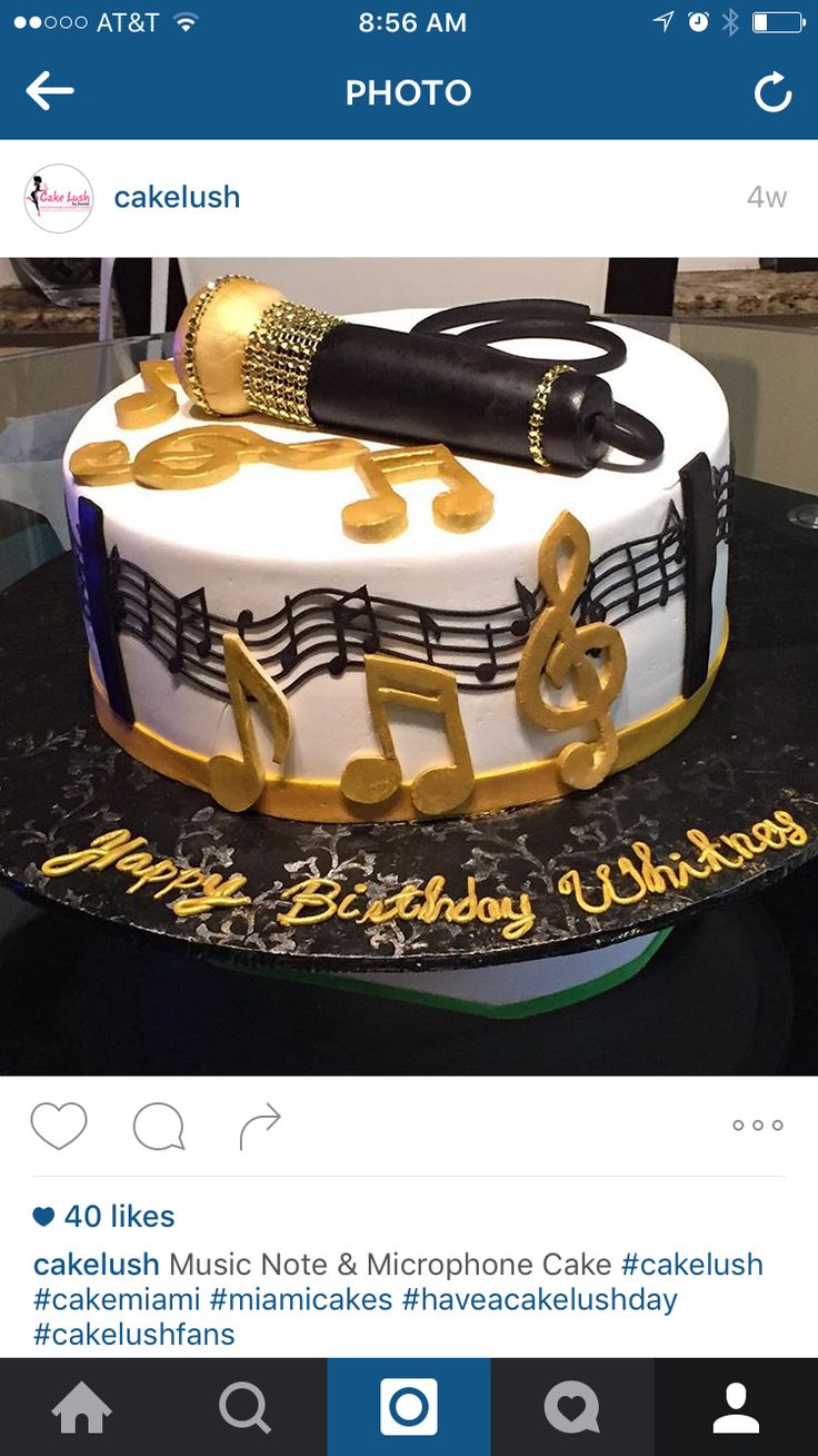 a cake with musical notes and microphone on top is displayed in the facebook page for this photo