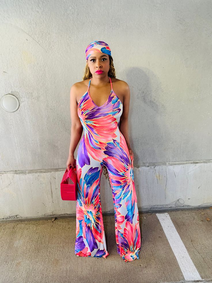 Take on the warmer months in this vibrant floral jumpsuit. The open back details sets way for maximum sunny-day appeal. Bold print and flattering fit for the WIN! Btw, the scarf is an added bonus. “𝕎𝕙𝕖𝕣𝕖 𝔽𝔸𝕊ℍ𝕀𝕆ℕ 𝕄𝕖𝕖𝕥𝕤 𝔽𝕀𝔼ℝℂ𝔼” Details & Care -Jumpsuit -V neck -Stretch -Open X back -Elastic waistband -Wide legs -Scarf included -No closure -Inseam is 36 inches -95% Polyester, 5% Spandex -Hand wash cold, Do not bleach, Hang dry Model Measurements Small: 5’4 (155lbs, 34, 28, 42) Multicolor Floral Print Jumpsuit For Day Out, Multicolor Floral Jumpsuits And Rompers For Day Out, Multicolor Floral Print Jumpsuits And Rompers For Day Out, Spring Casual Multicolor Print Jumpsuits And Rompers, Fitted Printed Jumpsuits And Rompers For Day Out, Trendy Multicolor Jumpsuits And Rompers For Day Out, Trendy Printed Jumpsuits And Rompers For Summer, Trendy Printed Jumpsuits And Rompers For Day Out, Multicolor Floral Print Jumpsuits For Spring