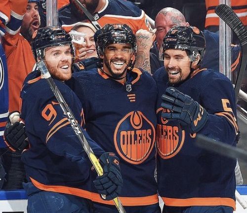 the edmonton oilers players are celebrating their goal