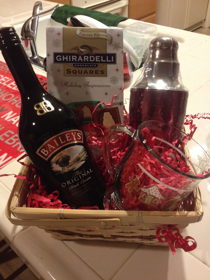 a basket filled with liquor bottles and condiments