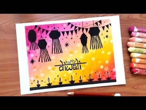 a card with the words happy diwal on it next to colored crayons