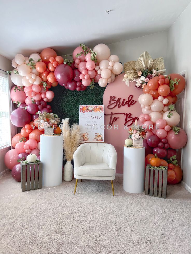 a room decorated with balloons and decorations for a bridal party or baby shower is shown