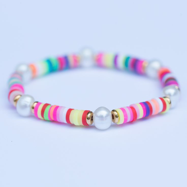 Rainbow beaded bracelet with fresh water pearls! Looks super cute stacked with other bracelets! This listing is for one bracelet Adjustable Pearl Beaded Bracelets Stackable, Adjustable Stackable Pearl Beaded Bracelets, Adjustable Multicolor Pearl Bracelet, Adjustable Multicolor Pearl Bracelets, Multicolor Adjustable Pearl Bracelets, Adjustable Multicolor Pearl Beaded Bracelet, Adjustable Multicolor Bracelet With Pearl Charm, Trendy Adjustable Bracelet With Pearl Charm, Multicolor Pearl Beaded Bracelets