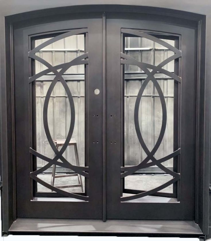 a double door with glass panels on the front and side doors, both in dark brown