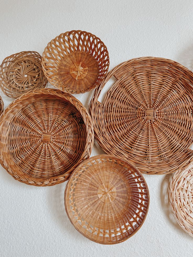 wicker baskets are arranged on the wall