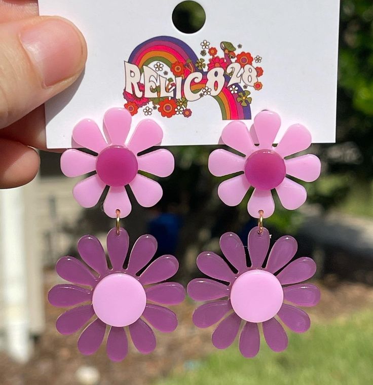 Step into the vibrant world of the 1960s with these 60s Pink and Purple Mod Flower Earrings. Inspired by the mod fashion of the era, these earrings feature a delightful combination of pink and purple hues in a bold flower design. Crafted from super lightweight acrylic, these earrings offer comfort without compromising on style. The posts are made of stainless steel, coated in 18k gold for a touch of elegance, and are nickel-free for a comfortable wearing experience. Product Details: Design: The Affordable Purple Retro Earrings, Trendy Pink Flower Earrings, Vintage Pink Flower Earrings For Party, Fun Pink Flower Jewelry, Fun Pink Flower-shaped Jewelry, Fun Pink Flower Earrings As Gift, Pink Fun Flower Earrings For Gift, Fun Pink Flower Earrings For Gift, Fun Pink Flower Earrings