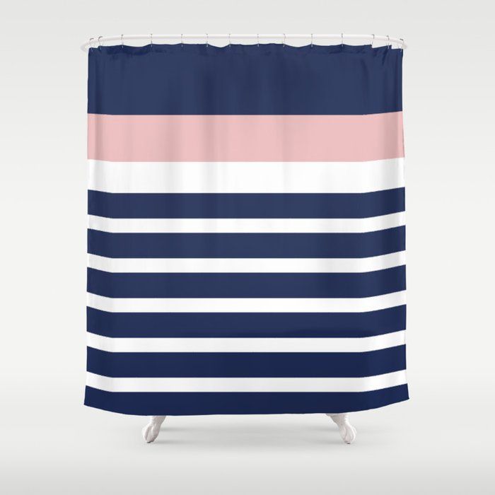 a blue and pink shower curtain with horizontal stripes on the bottom, in front of a white background