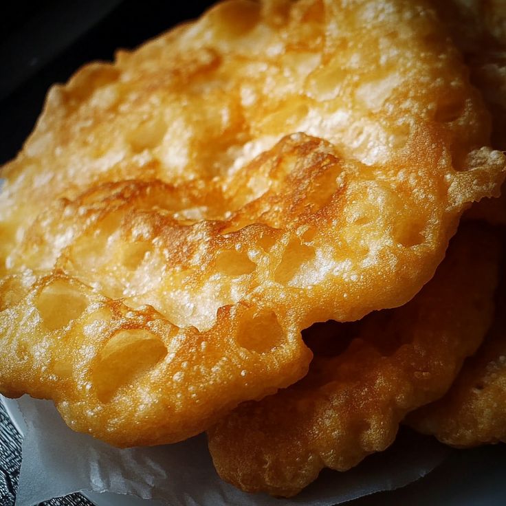 some fried food sitting on top of a piece of paper