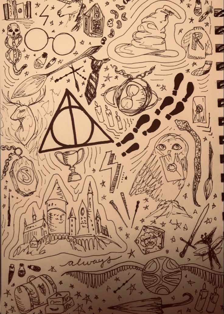 harry potter's symbols are drawn on paper