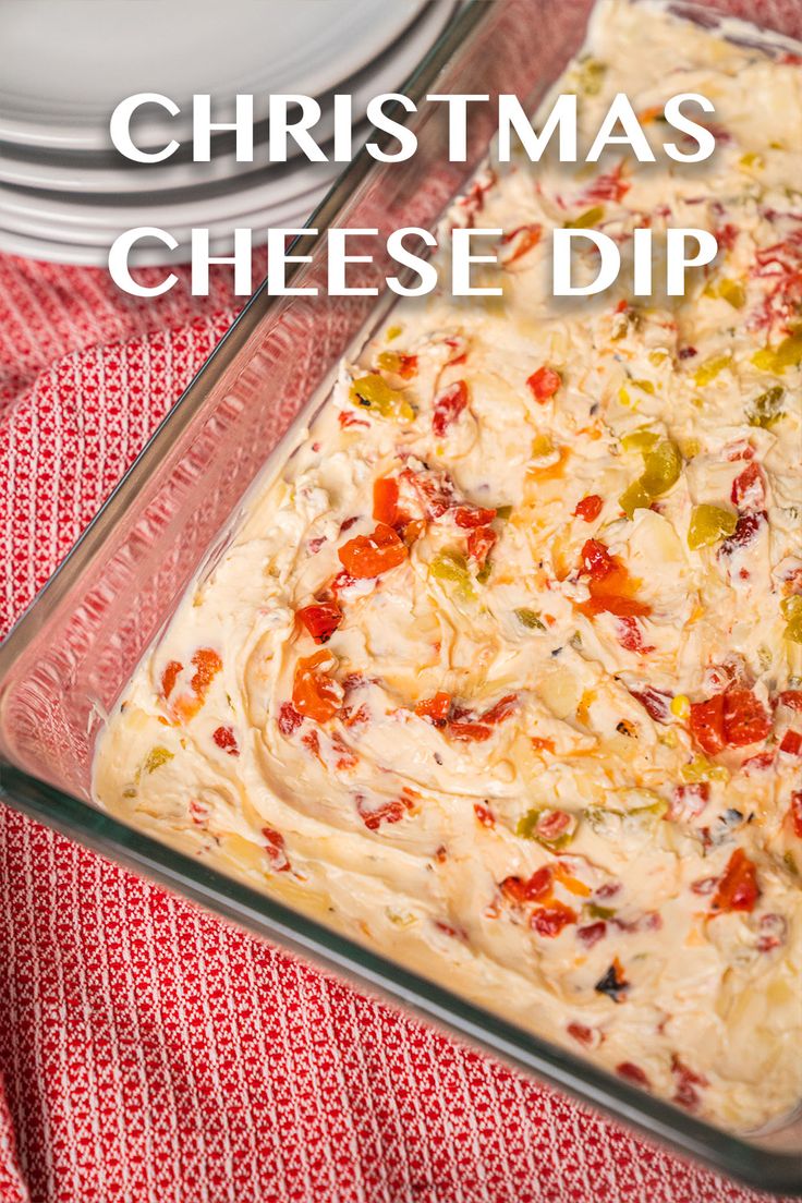 a casserole dish with cheese dip in it and the words christmas cheese dip