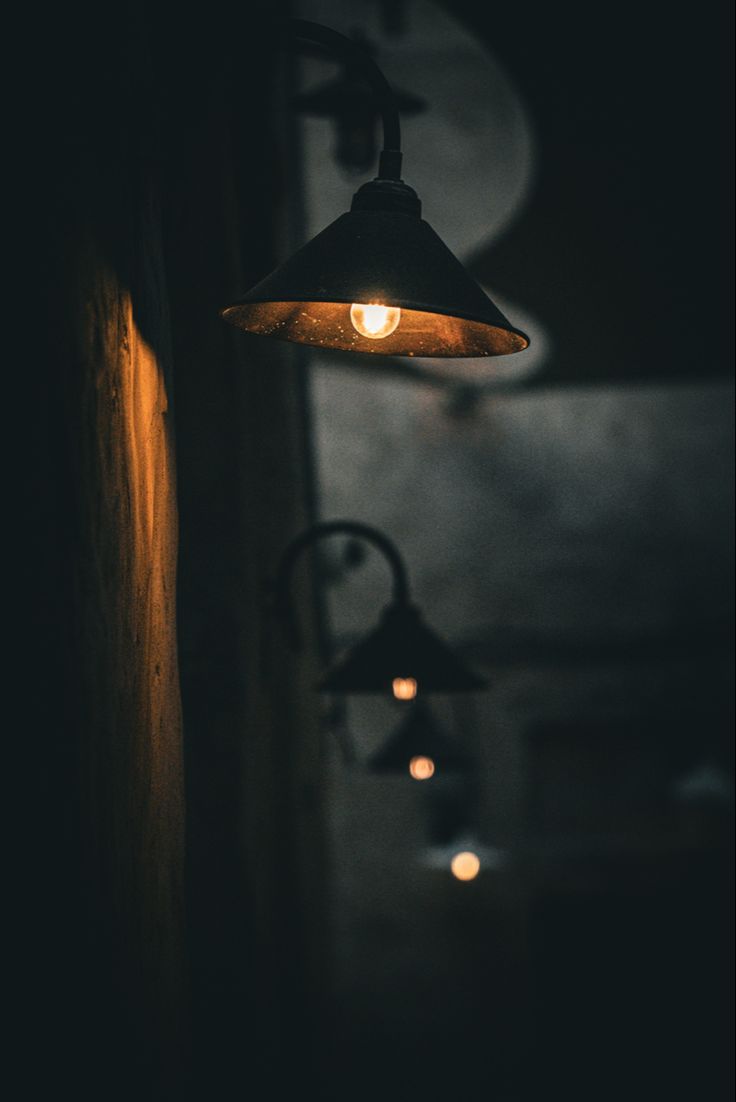 a light hanging from the side of a wall