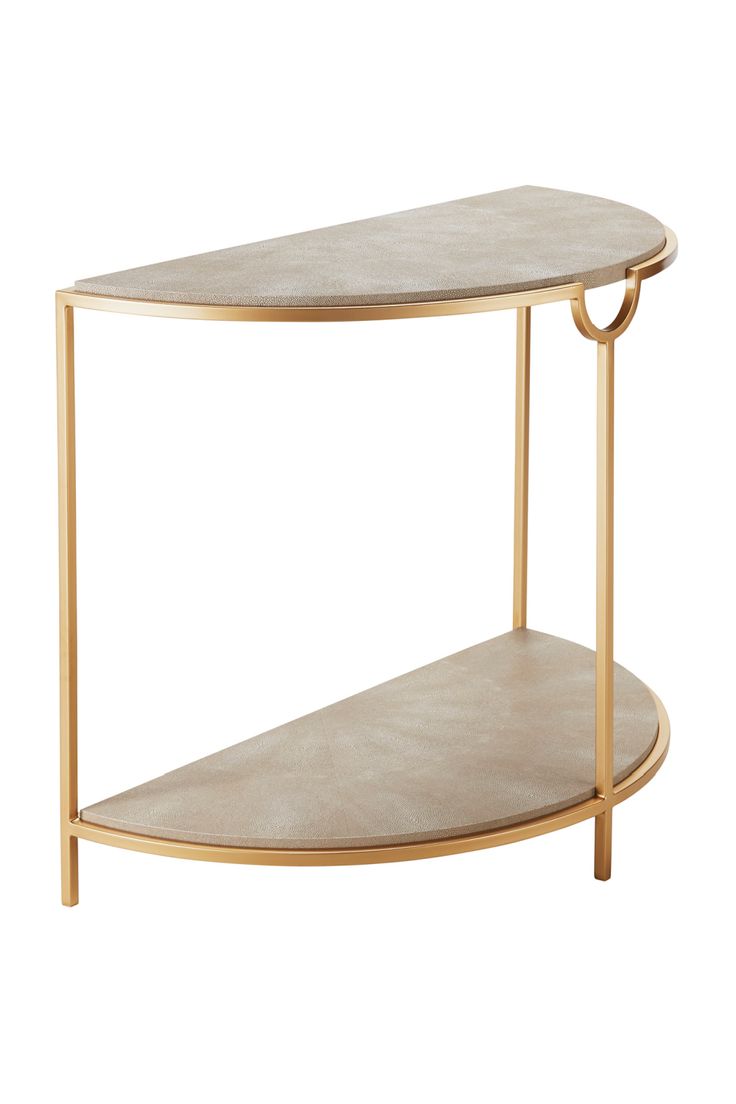 an oval shaped table with gold metal legs and a shelf on one side that has a marble top