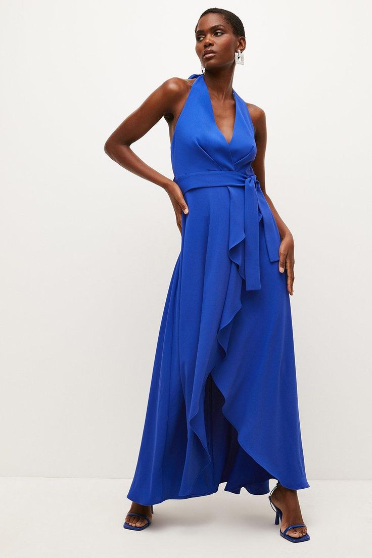 Be Ready For Long Summer Nights In This Draped Maxi Dress. Cascading With Romantic Frills, It Has A Luxe, Languid Vibe Emboldened By The Halter-Neck Straps, Open Back And Knotted Waist Tie. A Statement-Making Option For Vacation Dinners Or Summer Weddings, It Looks Best Work With Strappy Heels And Swept-Back Hair. Blue Belted Maxi Dress, Evening Floor-length Maxi Dress With Tie Waist, Floor-length Belted Party Dress, Belted Floor-length Party Dress, Blue Belted Maxi Dress For Party, Chic Tie Back Maxi Dress For Wedding Guest, Elegant Maxi Dress With Tie Waist, Elegant Belted V-neck Maxi Dress, Summer Formal Maxi Dress With Tie Waist