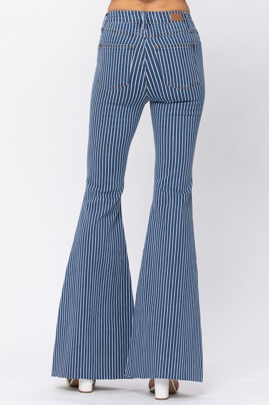 High waisted super flare pinstripe jeans. button front/pockets Trendy Pinstripe Wide Leg Bottoms, Retro Denim Blue Flares For Spring, Spring Dark Wash Cotton Flares, Trendy High Waist Pinstripe Bottoms, Trendy Pinstripe Bottoms For Spring, Retro Striped Cotton Jeans, Striped Denim Jeans With Pockets, Striped Wide Leg Denim Jeans, Casual Striped Flare Bottoms