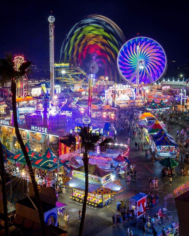 an aerial view of a carnival at night