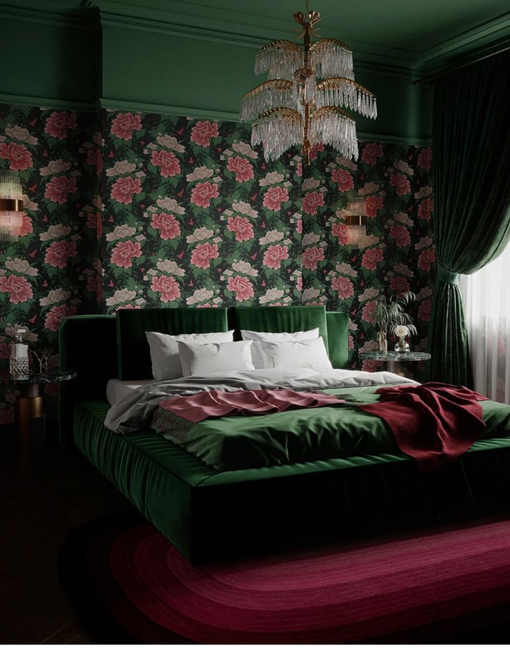 a bedroom with floral wallpaper and green bedding, chandelier hanging from the ceiling