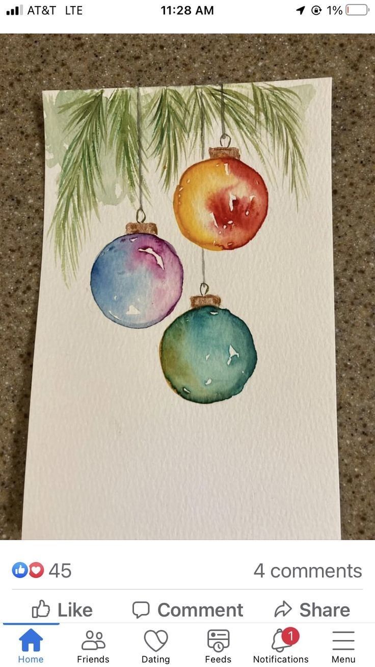 a card with three ornaments hanging from it