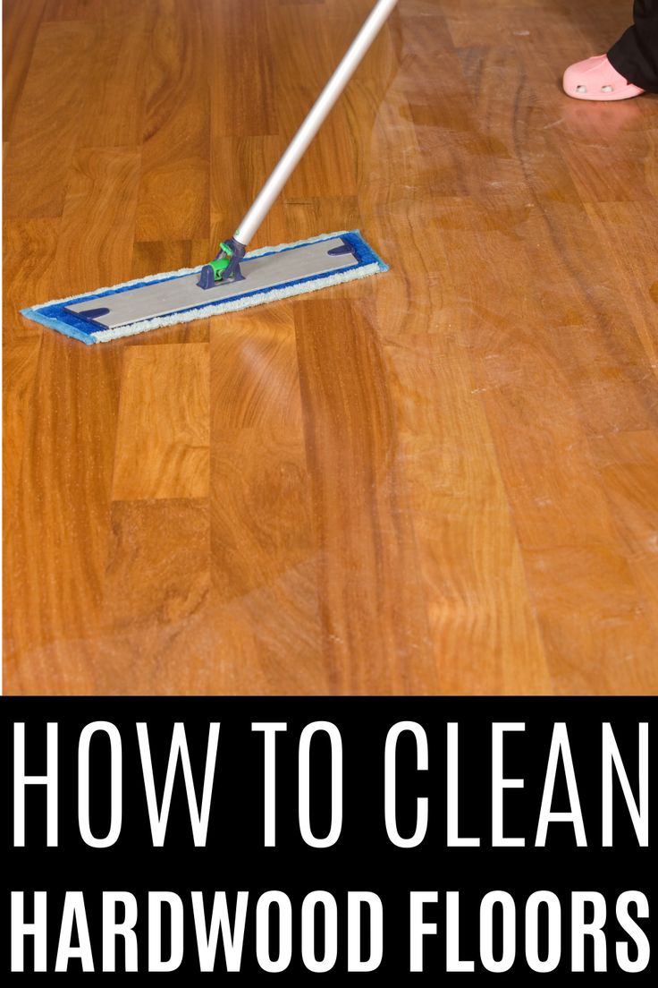 a person with a mop on the floor cleaning hardwood floors and how to clean hard wood floors