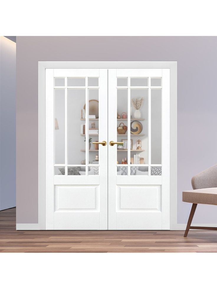 a white double door with glass panels in the middle and shelves on either side, next to a beige chair