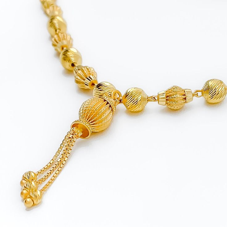 This 22k gold necklace, weighing a substantial 18.4 grams, presents a Royal Orb design, exuding magnificence and splendor. The yellow gold finish enhances its regal appearance. The 16-inch necklace length, along with a 1.5-inch drop and 1.75 inches of adjustable links, ensures a perfect fit and versatility in styling. Secured with a hook lock, this necklace is a symbol of opulence and grandeur, ideal for those who seek to make a majestic statement with their jewelry. PRODUCT DETAILS Gold Purity( Gold Temple Necklace With Intricate Design, Gold Long Temple Necklace With Intricate Design, Yellow Gold Long Temple Jewelry Necklace, Yellow Gold Long Necklace In Temple Jewelry Style, Elegant Yellow Gold Chain Necklace For Festivals, Ceremonial Gold Long Temple Necklace, Temple Style Long Yellow Gold Necklace, Yellow Gold Plated Long Drop Necklace, Ceremonial Yellow Gold-plated Necklaces