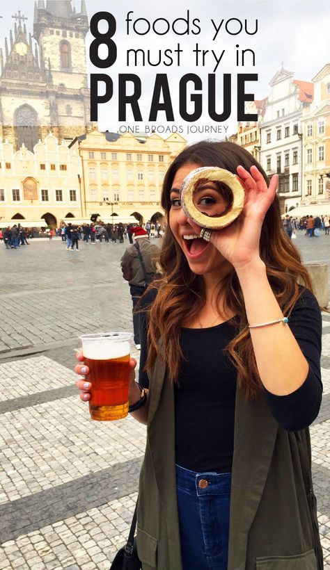 a woman holding a beer in front of her face with the words 8 foods you must try in prague