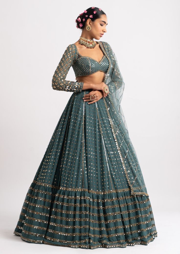 Sequins splash kali lehenga with heavy real hand cut mirror work border, round neck blouse clubbed with a mirror work dupatta. Kali Lehenga, Mirror Work Border, Mirror Work Dupatta, Tiered Lehenga, Vani Vats, Heavy Lehenga, Net Blouse, Round Neck Blouse, Net Blouses