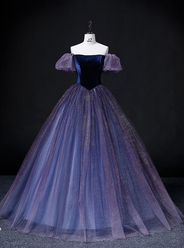 a purple and blue ball gown with puffy sleeves on a mannequin neckline