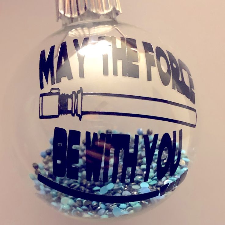 a glass ornament with the words may the force be with you on it