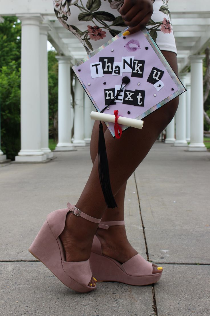 a woman's legs wearing high heels and a graduation cap with the words thank you next written on it