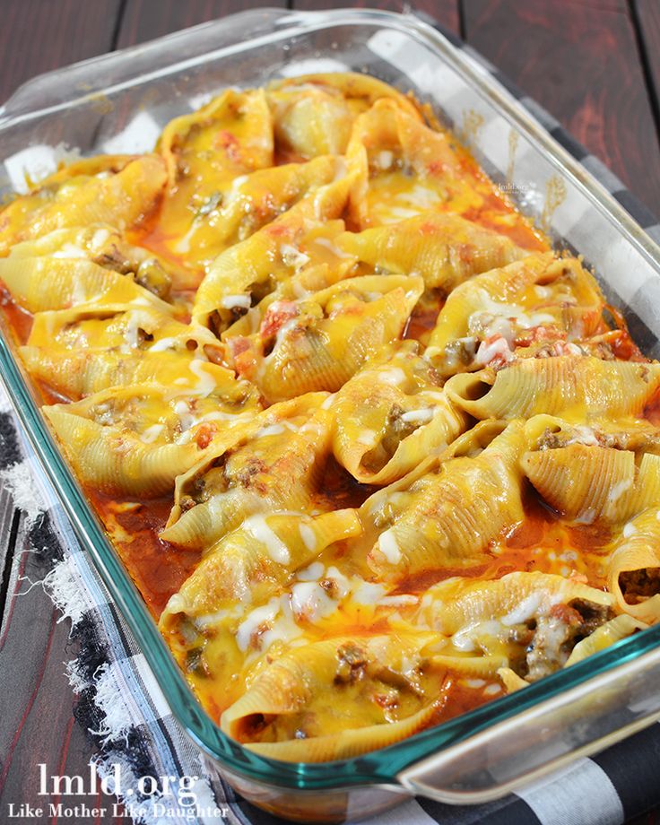 a casserole dish filled with shells and cheese