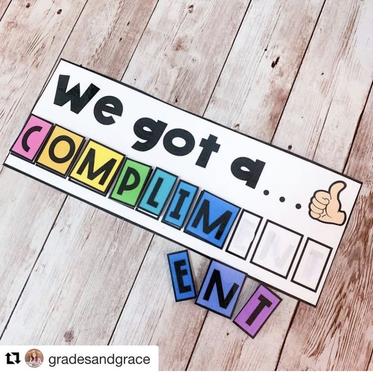 we got a complimim event sign and cut out letters on a wooden floor