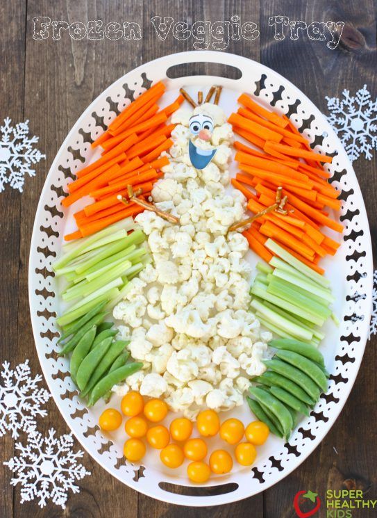 a platter with carrots, celery, onions and cauliflower