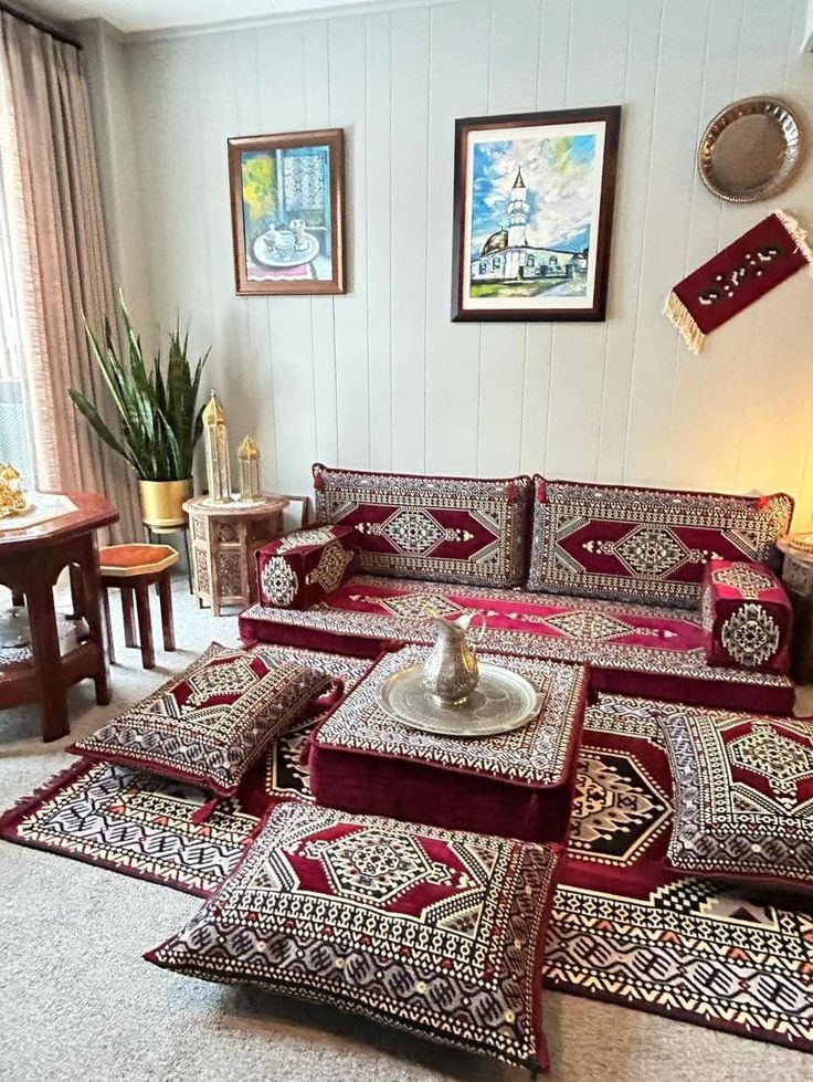 a living room filled with lots of furniture and rugs on top of each other