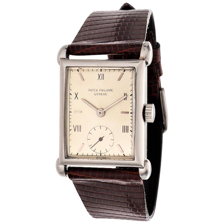 Introduction: This Patek Philippe 1530A Vintage rectangular stainless steel watch with fancy tear drop lugs, circa 1948. The case is made of Stainless Steel and measures 36 x 24 mm with silver dial and raised steel hour markers and Roman numerals. The watch comes with a 9"90 caliber movement #971184, case #651619. Date & Paperwork: The watch was made in 1948, confirmed with an extract from the archives confirming its date of manufacture and further sale in 1949. Additionally, the watch comes with a one year movement guarantee. Essay: The 1530 was in production from 1942 to1950, available in yellow gold, pink gold and a very small number were made in stainless steel. Specifications: - Year: 1948 - Movement Caliber: 9"90 - Case Diameter: 36 x 24 mm - Case Thickness: 6mm About Us: At Patek Mo Classic Jewelry And Watches With Rectangular Subdials, Classic Rectangular Dial Quartz Watch, Rectangular Brown Watches With Subdials, Brown Rectangular Watches With Subdials, Classic Watch With Polished Rectangular Dial, Classic Watch With Polished Finish And Rectangular Dial, Vintage Rectangular Watch Accessories With Diamond Hour Markers, Classic Formal Watch With Rectangular Dial, Antique Rectangular Watch Band For Formal Occasions