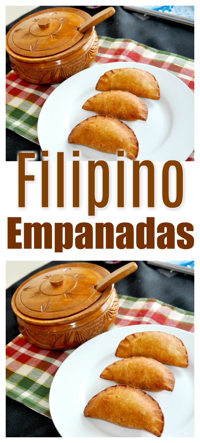 some food is sitting on a white plate with a wooden spoon in front of it and the words, filipino empanadas