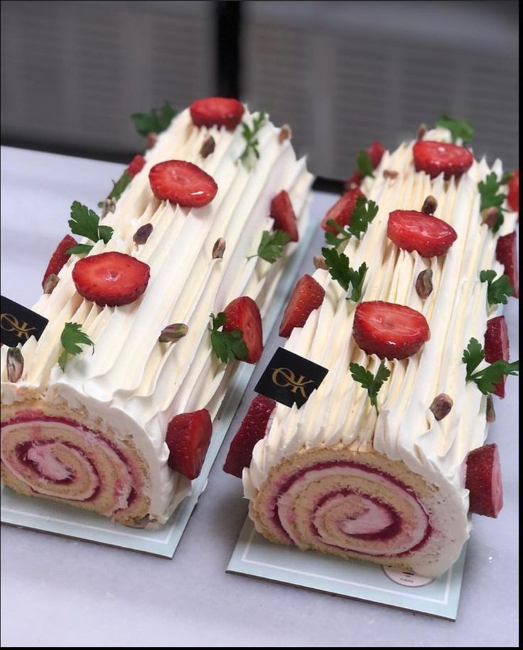 two slices of cake with strawberries on top