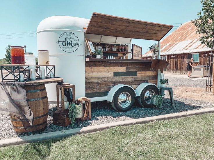 a food truck is parked on the side of the road