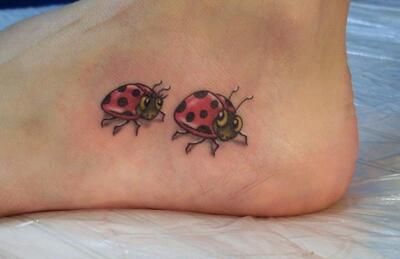 two ladybugs tattoo on the foot