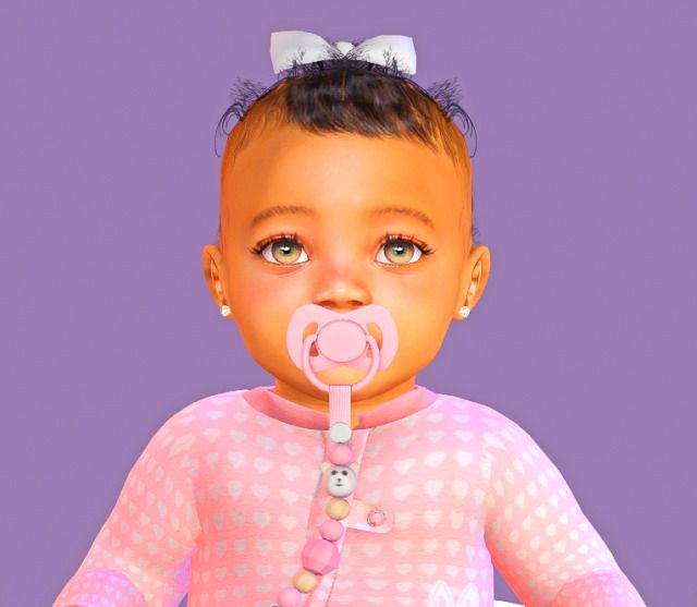 an animated baby doll with a pacifier in her mouth, wearing pink and white polka dots