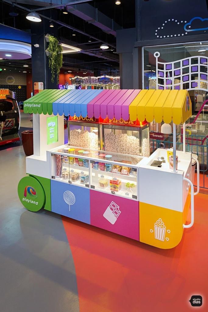 a brightly colored food stand in an airport